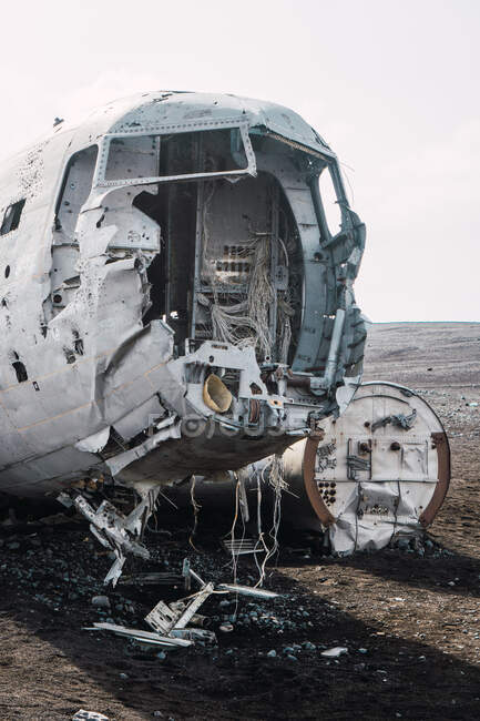 Ruins of aircraft after crash lying on ground in empty cold valley of Iceland. — Stock Photo