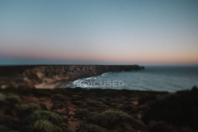 Cape and calm ocean — Stock Photo
