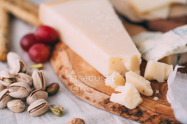 Parmesan on wooden board — Stock Photo