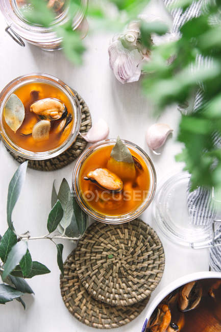 Mussels in glass jars — Stock Photo