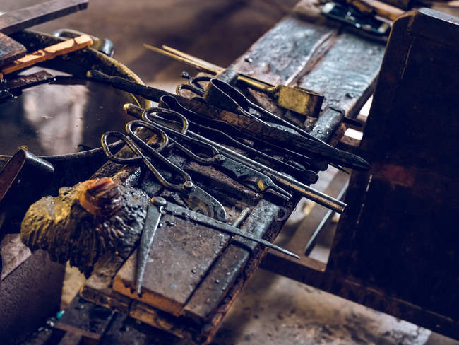 High angle view of row of different instruments on glass factory. — Stock Photo