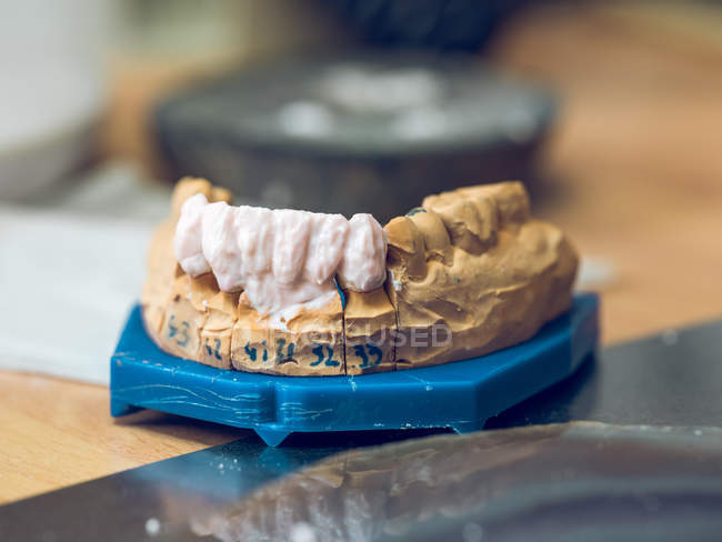 Artificial teeth on table — Stock Photo