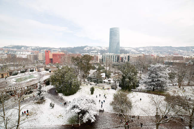Aerial view to park and houses covered with snow in Bilbao, Spain. — Stock Photo