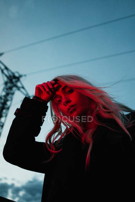 Blonde woman in dusk — Stock Photo