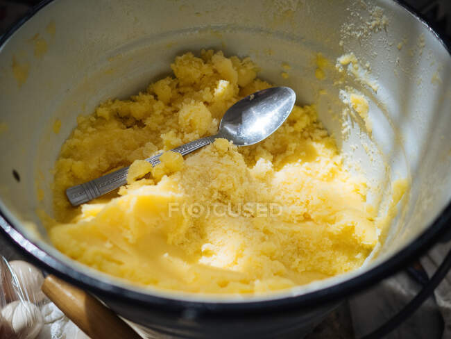 From above close-up shot of metal cooking pot with mass of mashed potato and spoon on top, Uzbekistan — Stock Photo