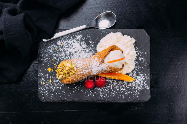 Breakfast dessert with whipped cream on slate — Stock Photo