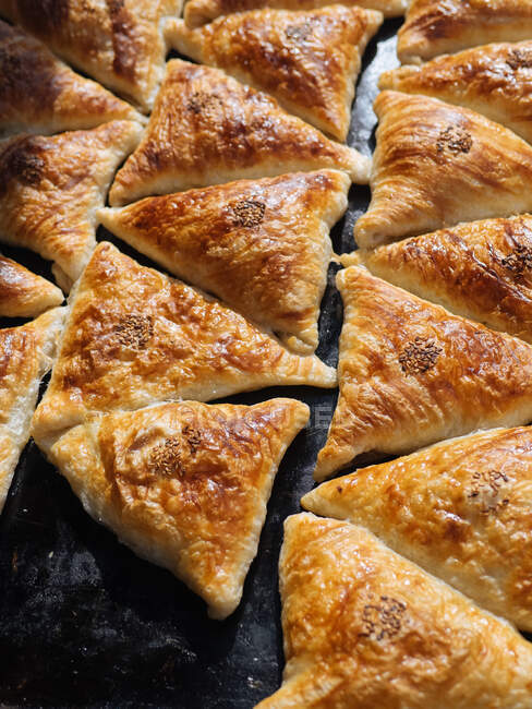 From above shot in close-up of delicious freshly baked samosa with sesame on golden crust, Uzbekistan — Stock Photo