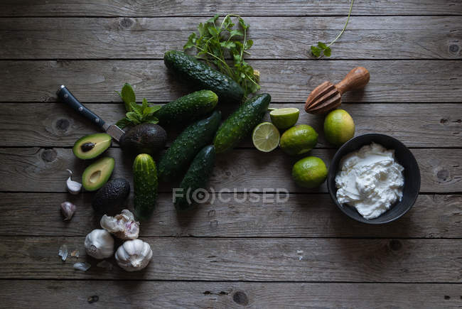 Ingredients for preparing tzatziki on wooden table — Stock Photo
