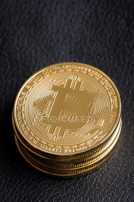 Bitcoins on leather background — Stock Photo