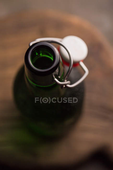 Opened beer bottle on dark background — Stock Photo