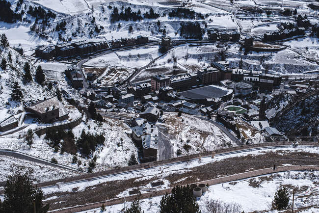 Aerial shot of remote town with simple infrastructure in wintertime with little snow. — Stock Photo