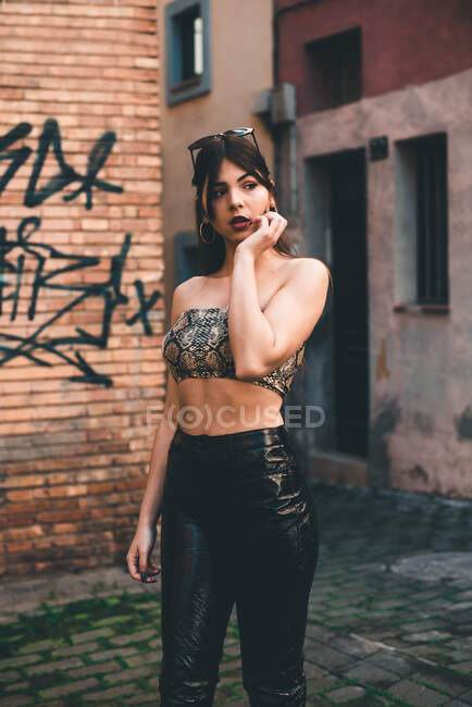 Beautiful woman in crop top posing outside — Stock Photo