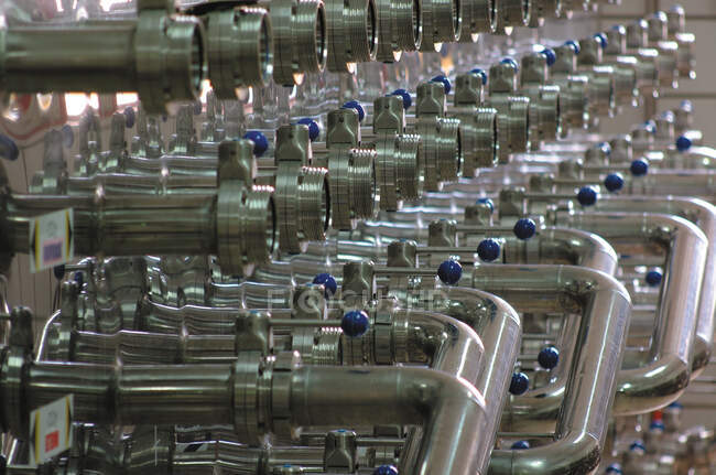 Metal fermentation valves in rows — Stock Photo