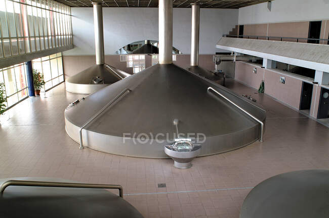 High beer tanks placed outside — Stock Photo