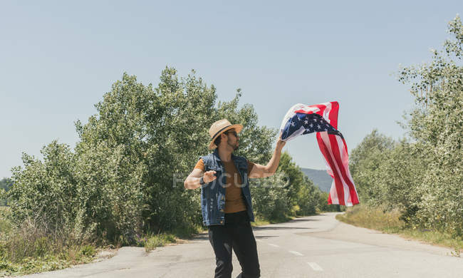 Man with American flag — Stock Photo