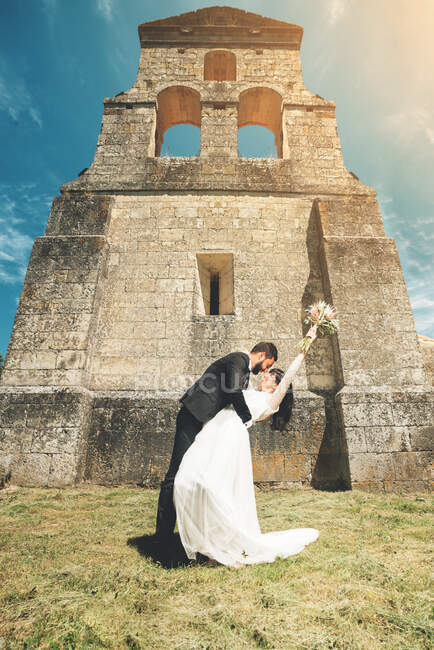 Young bride and groom standing together — Stock Photo