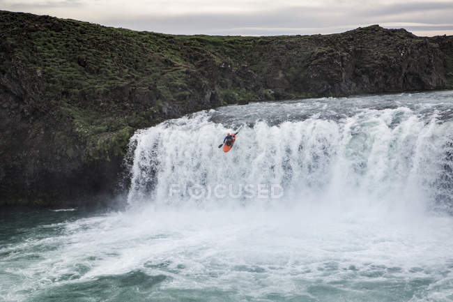 Person in kayak on water of mountain river, Iceland — Stock Photo