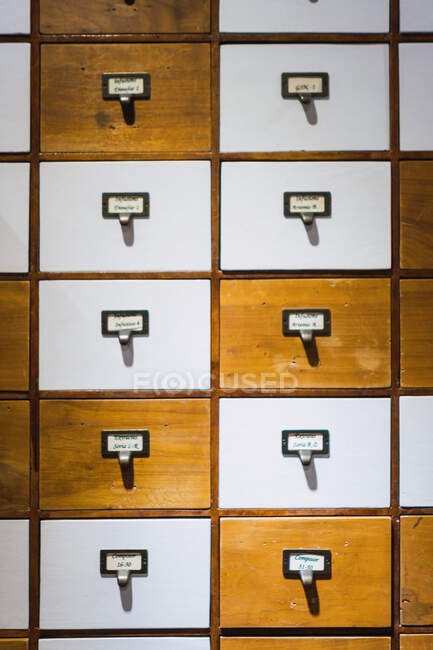 Wooden white and brown boxes with inscriptions?indoors — Stock Photo