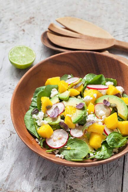 Top view of a Spinach, mango and avocado salad — Stock Photo