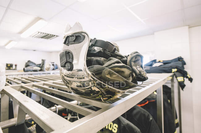 Helmet of firemen in locker room. — Stock Photo