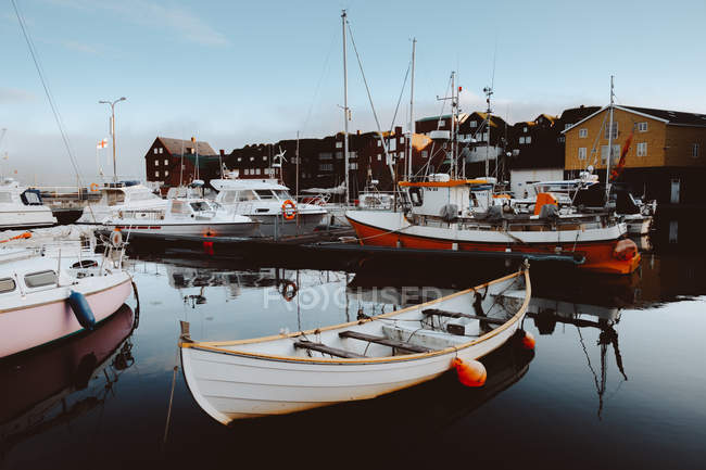 Small boats and different vessels at pier on Feroe Islands — Stock Photo