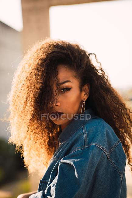 Portrait of young African American woman in denim shirt — Stock Photo