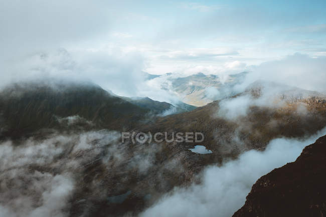 Rocky mountains in clouds on Feroe Islands — Stock Photo