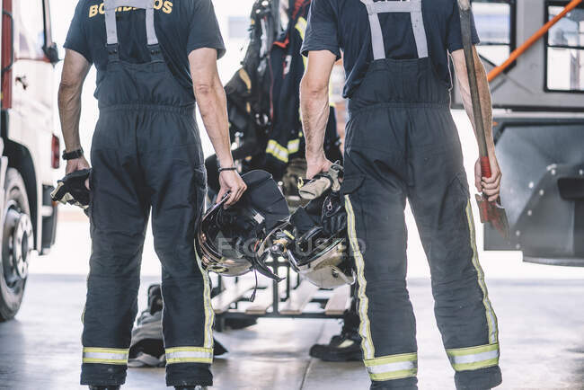 Firemen working at fire station. — Stock Photo