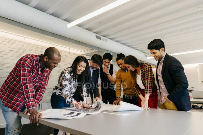 Office team working with blueprints — Stock Photo