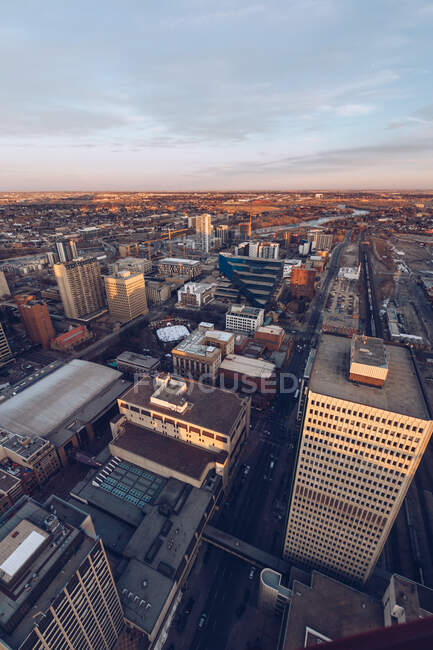 View from height of modern city infrastructure with towers of skyscrapers under blue dusk sky, Canada — Stock Photo