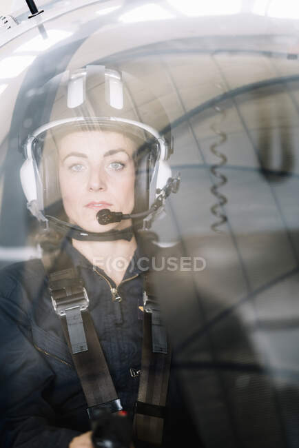 Pilot girl inside her helicopter. — Stock Photo