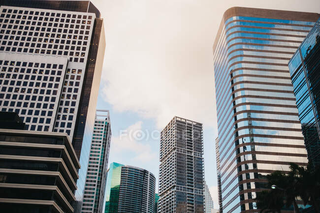 Skyscrapers on street of metropolis — Stock Photo