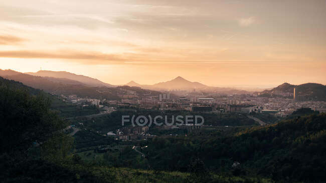 Large village at foot of mountain — Stock Photo