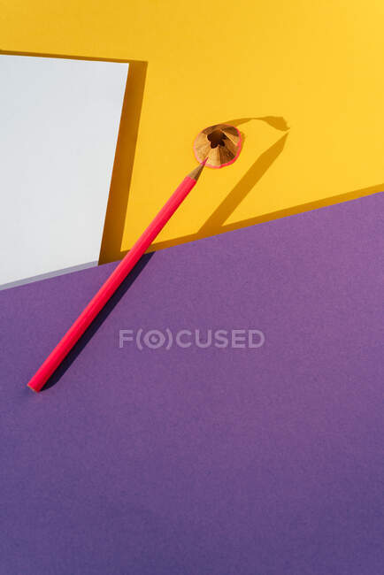 Back to school, modern geomeric background, pink Pencil and shavings from sharpening. — Stock Photo