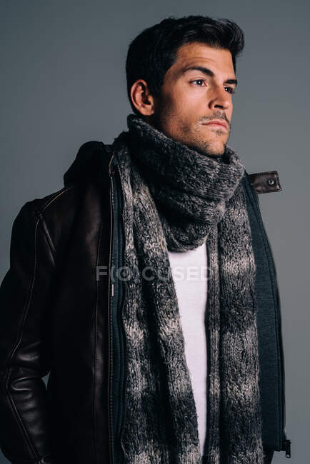Young attractive brunet man in a studio — Stock Photo