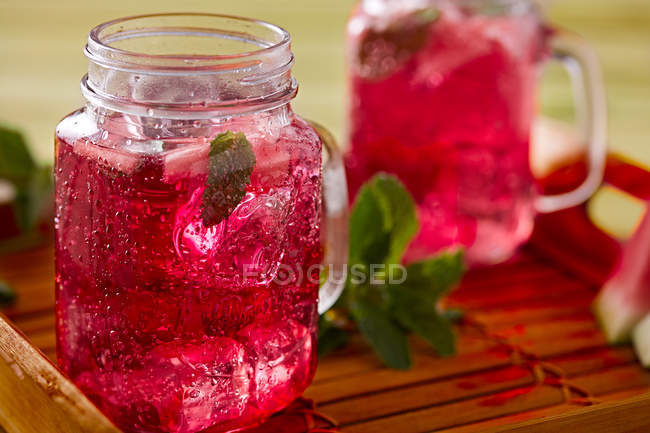 Close-up of watermelon lemonade in glass cups on wooden tray — Stock Photo