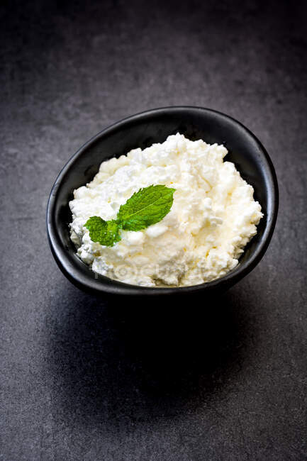 Fresh cottage cheese in a metal bowl — Stock Photo