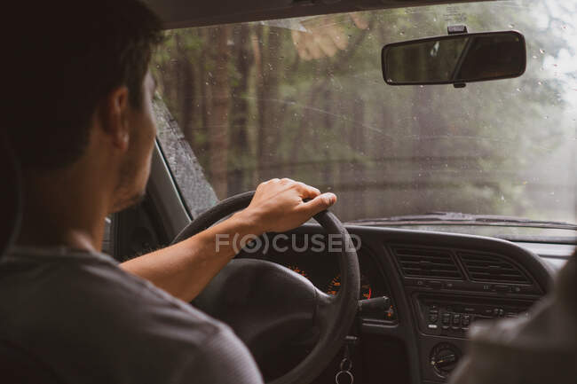 Anonymous guy driving modern vehicle along asphalt road in amazing countryside in Bulgaria, Balkans — Stock Photo