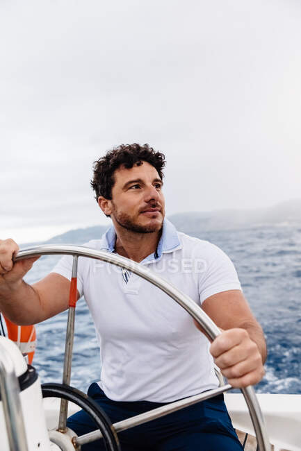 Captain of a ship sailing on a sailboat — leisure, age - Stock Photo ...