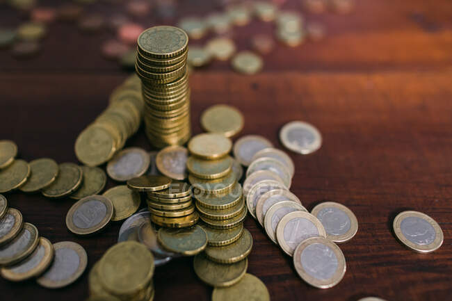 Shiny coins on table — Stock Photo