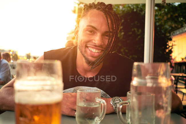 Young man sitting in bar — Stock Photo