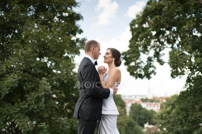 Married couple looking at each other in forest — Stock Photo