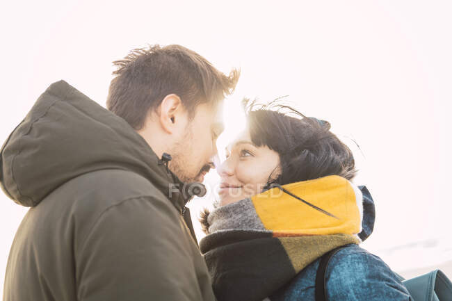 Couple outdoors looking at each other — Stock Photo