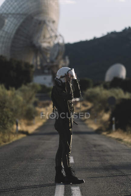 Beautiful woman posing dressed as an astronaut. — Stock Photo