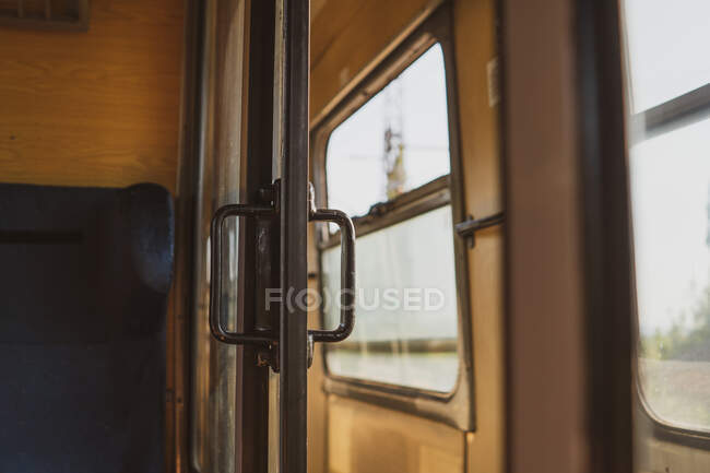 Old door of retro passenger compartment of train riding through Bulgaria, Balkans — Stock Photo
