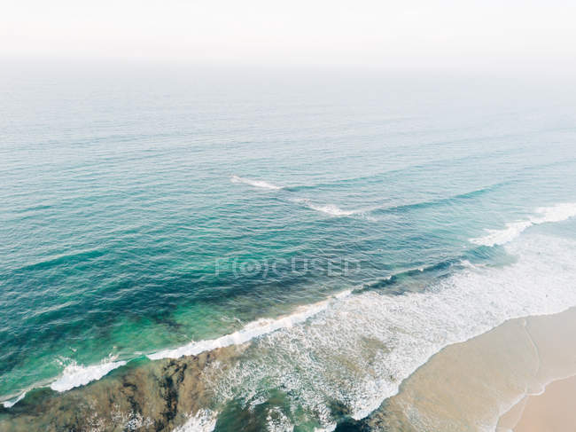 Landscape of seashore washed by sea water — Stock Photo
