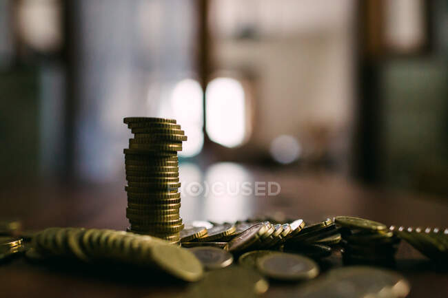 Shiny coins on table — Stock Photo