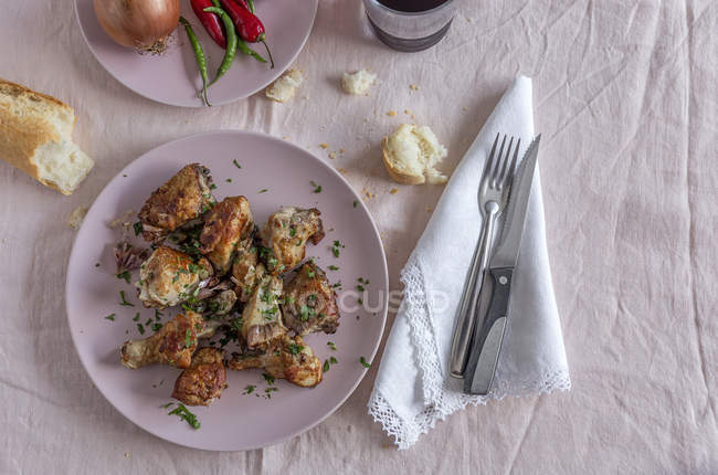 Fried chicken with onion and chili peppers, Flat lay — Stock Photo