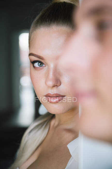 Bride looking to blurry groom — Stock Photo