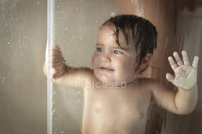 Cheerful mother with baby taking shower — Stock Photo